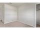 Inviting bedroom with neutral walls, plush carpet, closet, and natural light at 11501 N Pablo St, El Mirage, AZ 85335