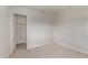 Minimalist bedroom with carpet flooring and a nearby closet, ready for your personal touch at 11501 N Pablo St, El Mirage, AZ 85335