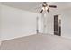 Bright, empty bedroom with carpet, ceiling fan and bathroom access at 11501 N Pablo St, El Mirage, AZ 85335