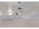 Expansive bonus room offering a neutral palette, plush carpet flooring, and abundant natural light at 11501 N Pablo St, El Mirage, AZ 85335