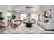 Open living area featuring modern furnishings, ample natural light, and a seamless flow at 11501 N Pablo St, El Mirage, AZ 85335