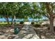 Tree-lined walking path surrounded by lush greenery offering a tranquil outdoor experience at 11501 N Pablo St, El Mirage, AZ 85335