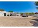 Property featuring desert landscaping, a southwestern-style home, and a trailer or moving container at 13238 N 78Th St, Scottsdale, AZ 85260