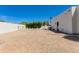 Large backyard featuring minimalist desert landscaping and block wall fencing for privacy at 13238 N 78Th St, Scottsdale, AZ 85260