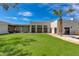 Expansive backyard with lush lawn, mature trees, and covered patio, ideal for outdoor living at 13238 N 78Th St, Scottsdale, AZ 85260