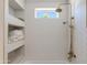Elegant bathroom featuring a stylish shower with gold fixtures and built-in shelving for towels at 13238 N 78Th St, Scottsdale, AZ 85260