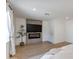 Bedroom with fireplace, wood floors, and natural light at 13238 N 78Th St, Scottsdale, AZ 85260