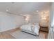 Bright bedroom with stylish pendant lighting, white walls, and plush rug creating a calming atmosphere at 13238 N 78Th St, Scottsdale, AZ 85260