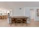 Inviting dining area with wood table, chairs and access to bright kitchen with modern finishes at 13238 N 78Th St, Scottsdale, AZ 85260