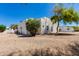 This property offers minimalist landscaping, mature trees, and a southwestern-style home at 13238 N 78Th St, Scottsdale, AZ 85260