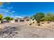 Spacious home featuring a wide driveway, a two-car garage, and a beautifully landscaped front yard at 13238 N 78Th St, Scottsdale, AZ 85260
