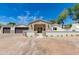 Charming single-story home with brick and stone accents, a well-manicured yard, and a welcoming entrance at 13238 N 78Th St, Scottsdale, AZ 85260
