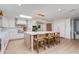Open-concept kitchen featuring a large island with seating, stylish pendant lighting, and plenty of counter space at 13238 N 78Th St, Scottsdale, AZ 85260