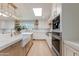 Gourmet kitchen featuring stainless steel appliances, a large island with a farmhouse sink, and plenty of storage at 13238 N 78Th St, Scottsdale, AZ 85260