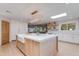 Modern kitchen with an island, farmhouse sink, and updated appliances at 13238 N 78Th St, Scottsdale, AZ 85260