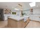 Bright kitchen featuring an island, pendant lights, and custom cabinets at 13238 N 78Th St, Scottsdale, AZ 85260