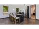 Modern kitchenette with stainless steel appliances, a breakfast bar, and sleek countertops at 13238 N 78Th St, Scottsdale, AZ 85260