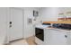 Functional laundry room with modern washer and dryer, water dispenser, and ample storage space at 13238 N 78Th St, Scottsdale, AZ 85260