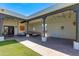 A covered outdoor patio with a comfortable seating area, perfect for enjoying the serene surroundings at 13238 N 78Th St, Scottsdale, AZ 85260
