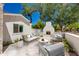 Inviting outdoor patio area featuring a cozy fireplace and stylish seating, perfect for relaxation and entertaining at 13238 N 78Th St, Scottsdale, AZ 85260