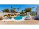 Inviting backyard pool featuring a waterfall, lush landscaping, and ample space for outdoor entertaining at 13238 N 78Th St, Scottsdale, AZ 85260