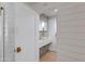 Powder room featuring decorative tiles, modern sink, and brass fixtures at 13238 N 78Th St, Scottsdale, AZ 85260