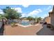Enjoy this tranquil outdoor space with a pool, spa, lounge chairs, and fire pit at 13256 N 153Rd Ln, Surprise, AZ 85379