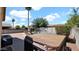 Backyard featuring a pool, hot tub, lounge chairs, brick patio, and landscaping at 13256 N 153Rd Ln, Surprise, AZ 85379
