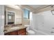 Bathroom showcasing granite countertop sink vanity, shower, tub, and toilet at 13256 N 153Rd Ln, Surprise, AZ 85379