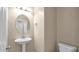 Powder room featuring a pedestal sink and a toilet at 13256 N 153Rd Ln, Surprise, AZ 85379