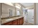 Bathroom featuring double sink vanity with granite countertop, shower with curtain, and tile flooring at 13256 N 153Rd Ln, Surprise, AZ 85379