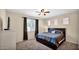 Comfortable primary bedroom featuring a large window for natural light and a ceiling fan at 13256 N 153Rd Ln, Surprise, AZ 85379