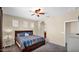 Warm and inviting main bedroom featuring a ceiling fan, lots of light and ensuite bathroom at 13256 N 153Rd Ln, Surprise, AZ 85379
