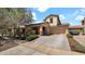 Inviting two-story home with a spacious driveway, a two-car garage, and manicured landscaping at 13256 N 153Rd Ln, Surprise, AZ 85379