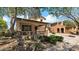 Charming home with a covered porch, stone details, and mature landscaping, offering curb appeal at 13256 N 153Rd Ln, Surprise, AZ 85379