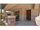 Welcoming covered porch with stone accents, offering a cozy outdoor space near the front door at 13256 N 153Rd Ln, Surprise, AZ 85379