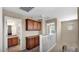 Upstairs hallway featuring built in cabinets, a bathroom, and a bedroom at 13256 N 153Rd Ln, Surprise, AZ 85379
