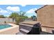 A relaxing hot tub, ready for soaking, sits on a brick patio at 13256 N 153Rd Ln, Surprise, AZ 85379