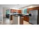 Modern kitchen featuring stainless steel appliances, dark granite countertops and stylish wood cabinets at 13256 N 153Rd Ln, Surprise, AZ 85379
