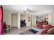 An open-concept living room, kitchen and dining area create the perfect space to relax and unwind at 13256 N 153Rd Ln, Surprise, AZ 85379