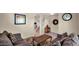Comfortable living room featuring neutral walls, plush sofas, and a staircase, creating a cozy atmosphere at 13256 N 153Rd Ln, Surprise, AZ 85379