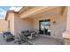 Cozy covered patio area with dining set, perfect for outdoor entertaining and relaxation by the poolside view at 13256 N 153Rd Ln, Surprise, AZ 85379