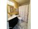Well-lit bathroom offers a tub and shower combination, vanity with sink, and tile flooring at 14254 N Boxwood Ln # 158B, Fountain Hills, AZ 85268