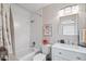 Clean bathroom featuring a tub, sleek white subway tiles, modern vanity, and well-lit mirror at 14254 N Boxwood Ln # 158B, Fountain Hills, AZ 85268