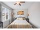 Comfortable bedroom with a bed, neutral walls, and Southwestern-inspired artwork, bathed in natural light at 14254 N Boxwood Ln # 158B, Fountain Hills, AZ 85268