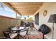 Inviting covered patio features tile floors, stylish seating, and an outdoor grill at 14254 N Boxwood Ln # 158B, Fountain Hills, AZ 85268