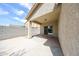 Covered patio includes a sliding glass door and a view of the backyard block wall at 14262 N 142Nd Ln, Surprise, AZ 85379