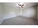 Bright bedroom with plush carpet and a ceiling fan, ready for personalization at 14262 N 142Nd Ln, Surprise, AZ 85379