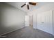 Bedroom features neutral colored walls, carpeted floors, and double door closets at 14262 N 142Nd Ln, Surprise, AZ 85379