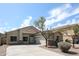 Charming single-story home featuring a desert landscaped front yard and a two-car garage, perfect for suburban living at 14262 N 142Nd Ln, Surprise, AZ 85379
